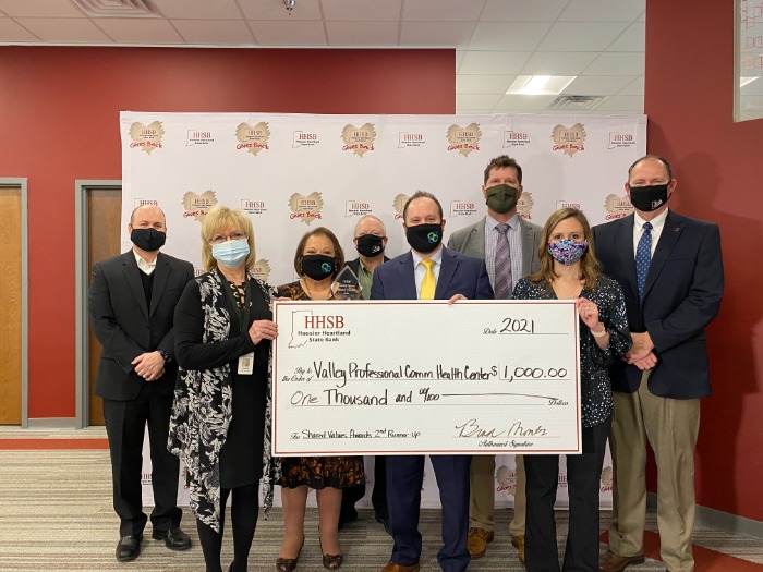 HSSB Team holding check