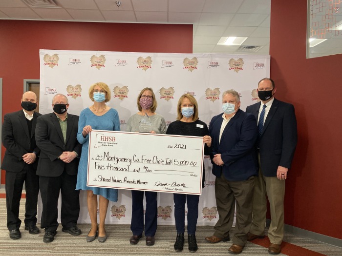 HHSB Team holding check