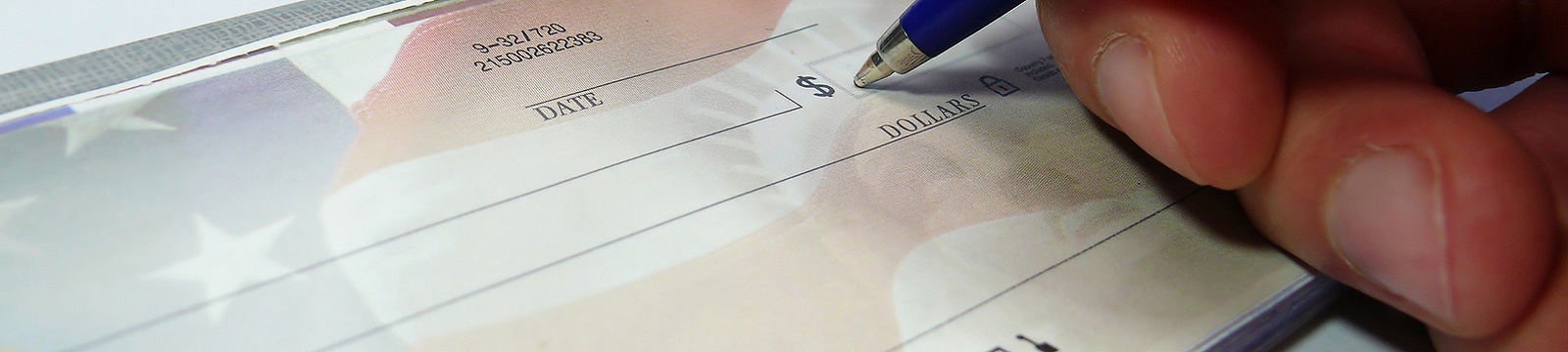 Person writing a check