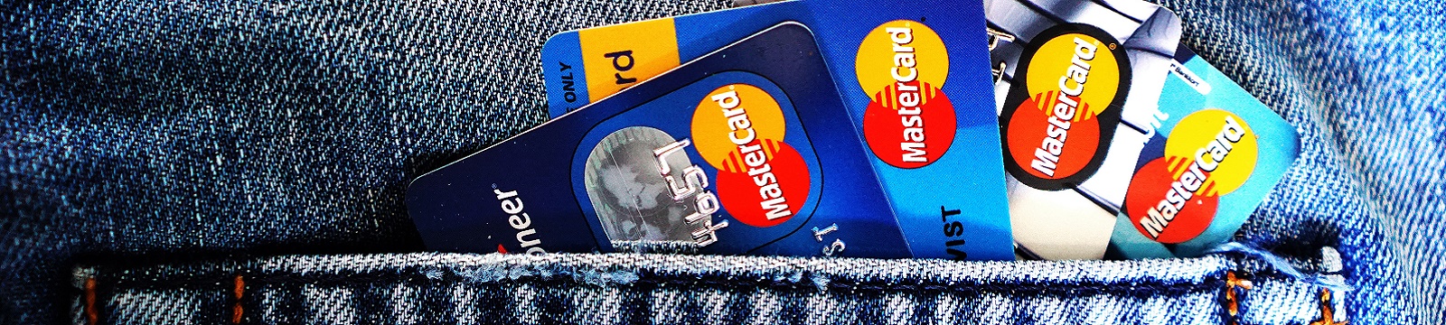 Debit cards in a jeans pocket