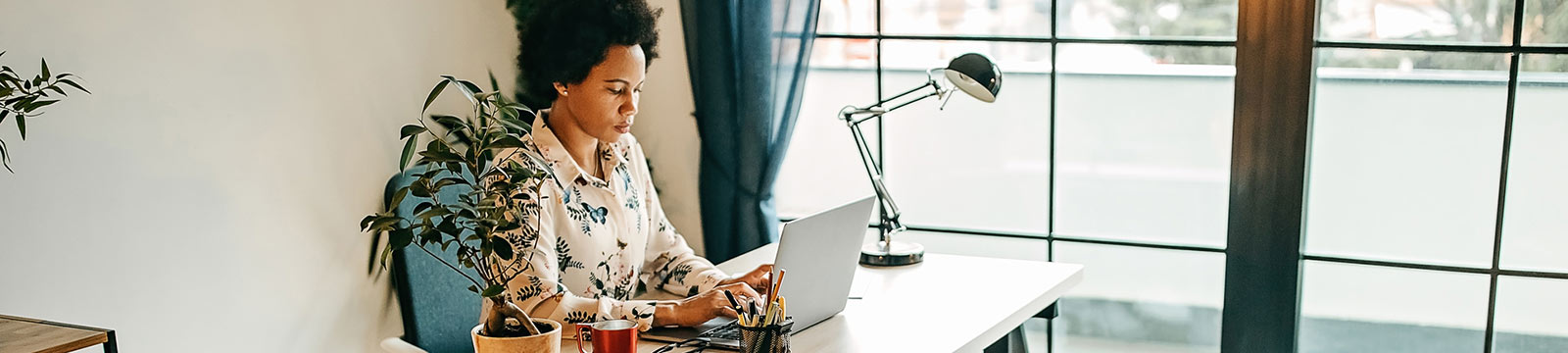 Woman working in bright office.