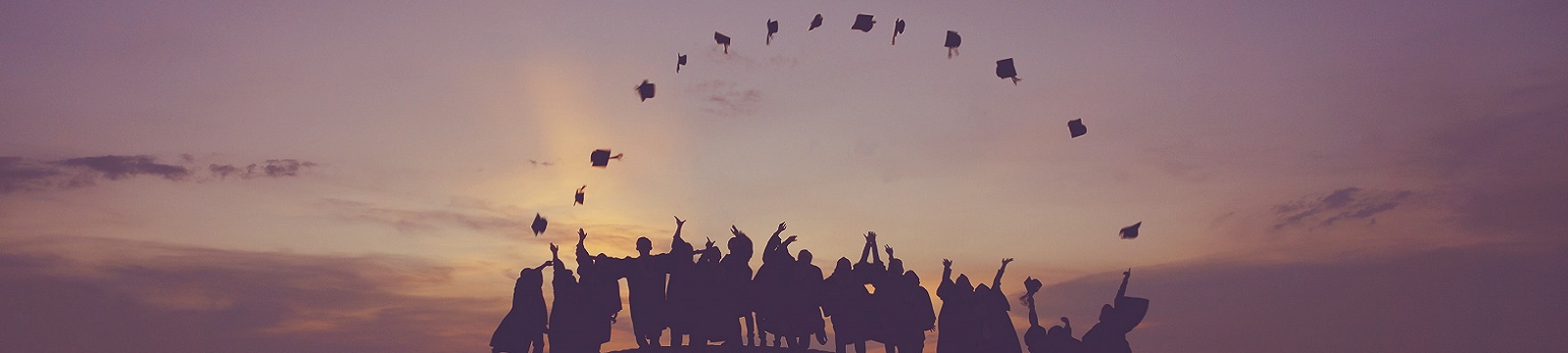 Graduates throwing their caps in the air