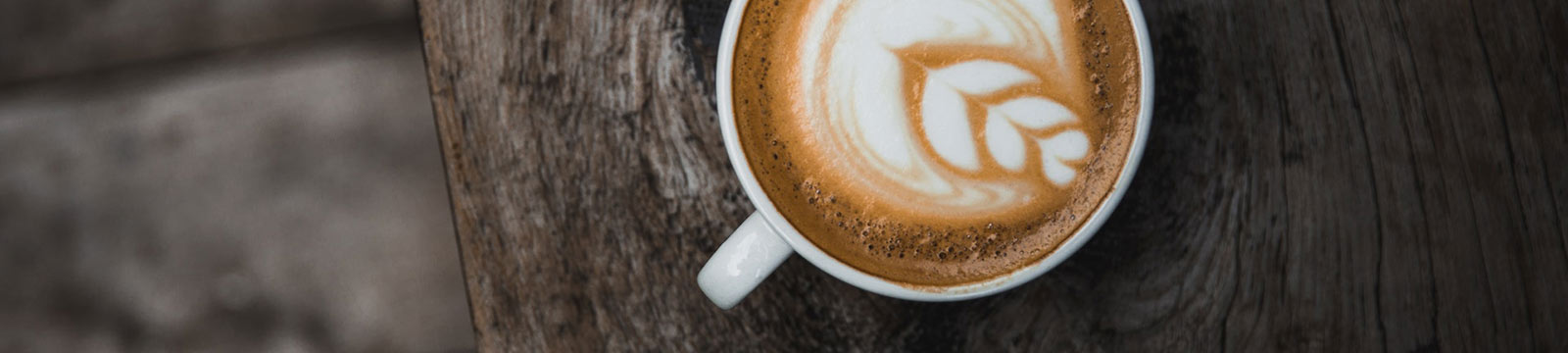 Latte on wood table.